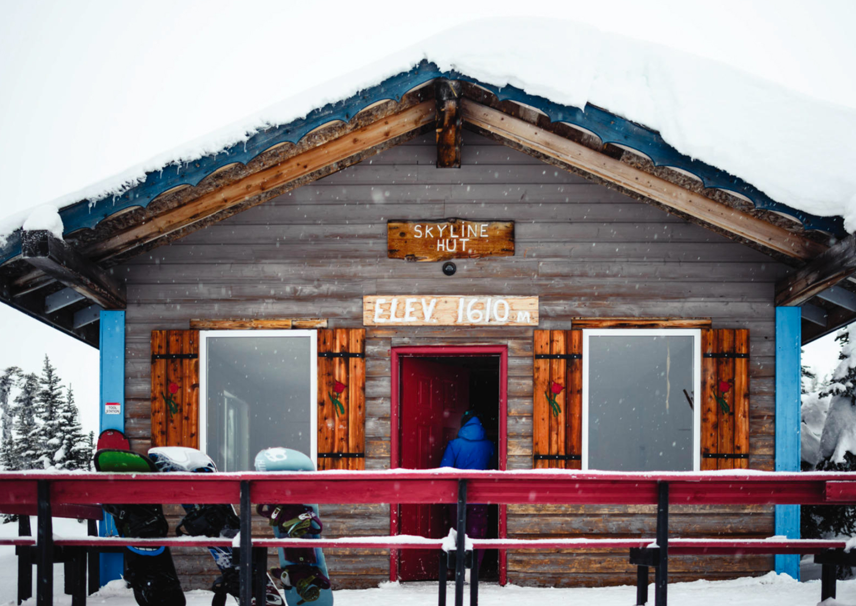 Snowboarders entering cabins at Hudson Bay Mountain Resort, near Smithers. Photo by Destination BC/Andrew Strain.