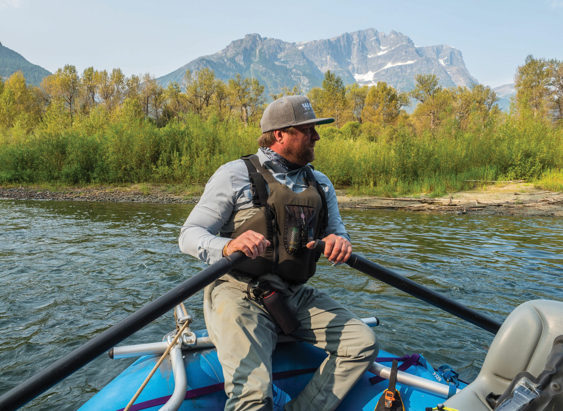 Guide Jessib Padgett steers the boat down the Atnarko. Photo by Diane Selkirk.