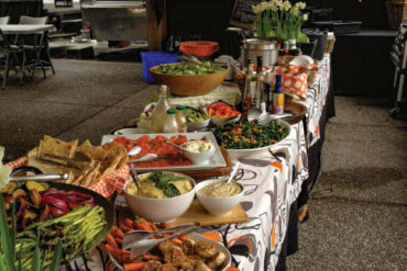 Edible Planet's bountiful buffet table, pre-Covid. Photo by Lisanne Collett.