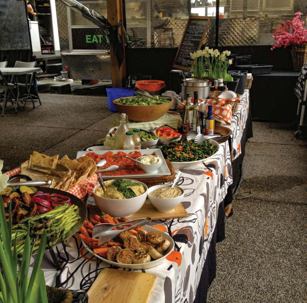 Edible Planet's bountiful buffet table, pre-Covid. Photo by Lisanne Collett.